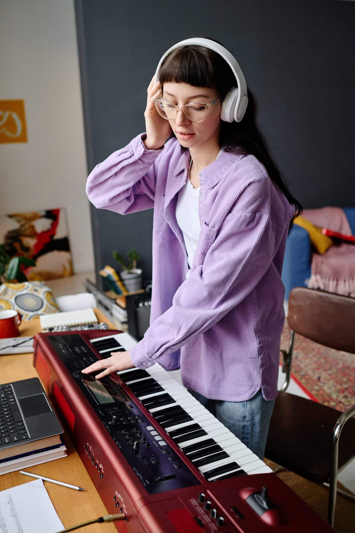 Woman playing piano to record song